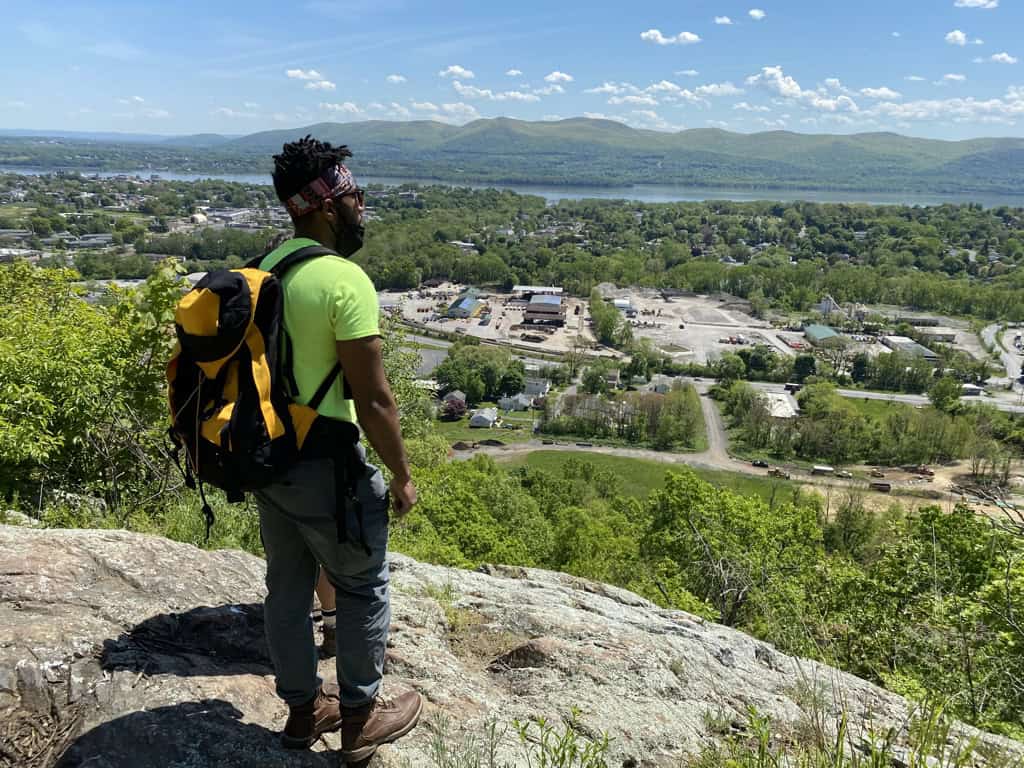 Person overlooking a scenic landscape.